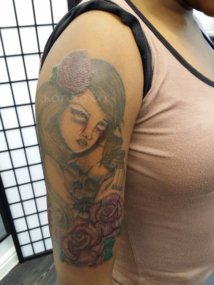 girl with skull half sleeve tattoo